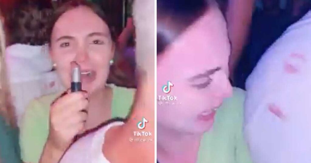 Mulher malvada pinta beijos na camisa de homens na discoteca
